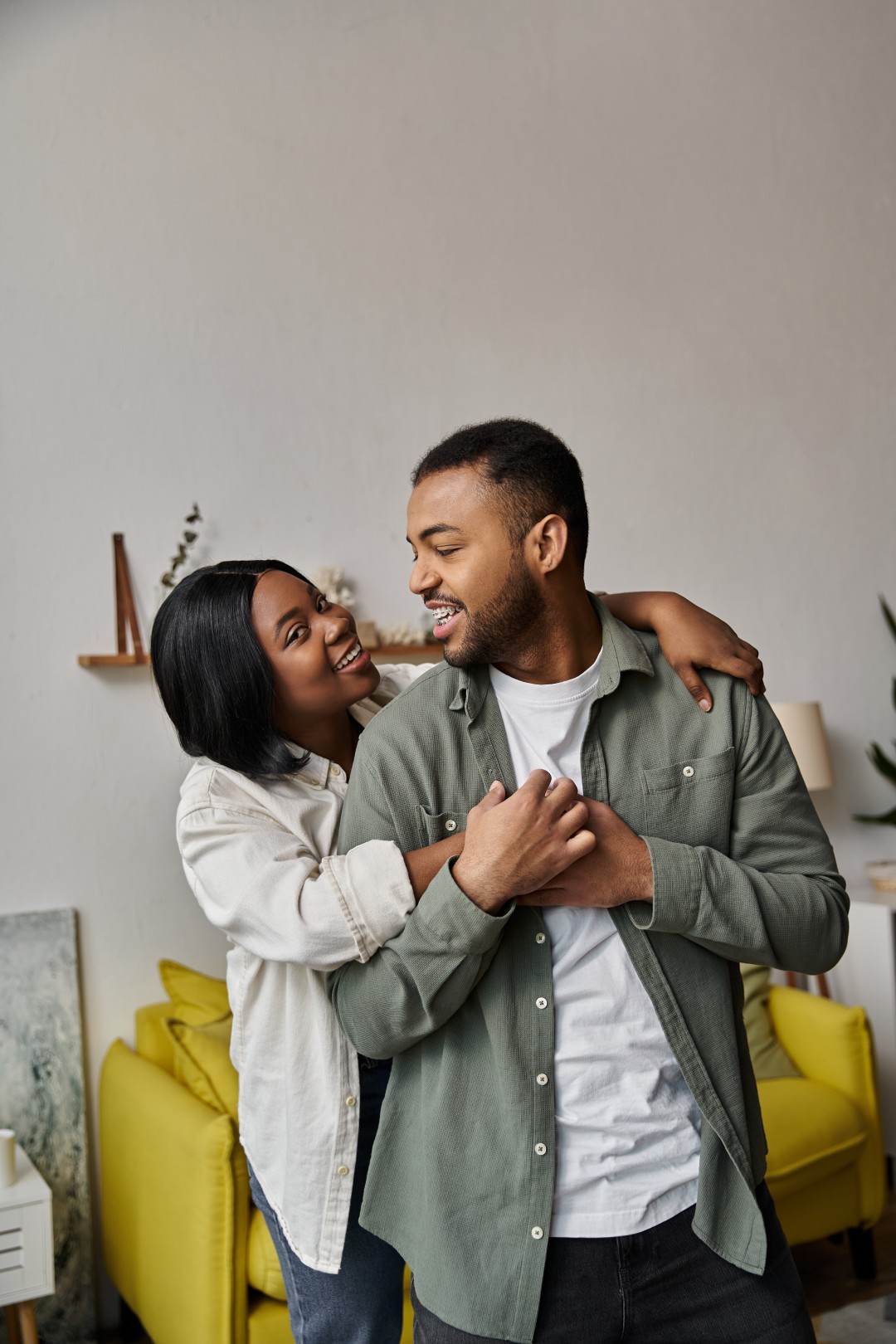 A happy African American couple enjoys a loving moment at home.